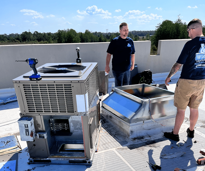 Workers installing AC unit in Cape Coral