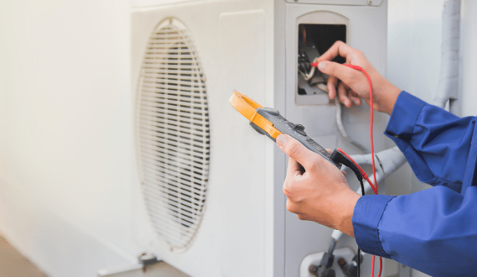 Outdoor AC Unit being checked